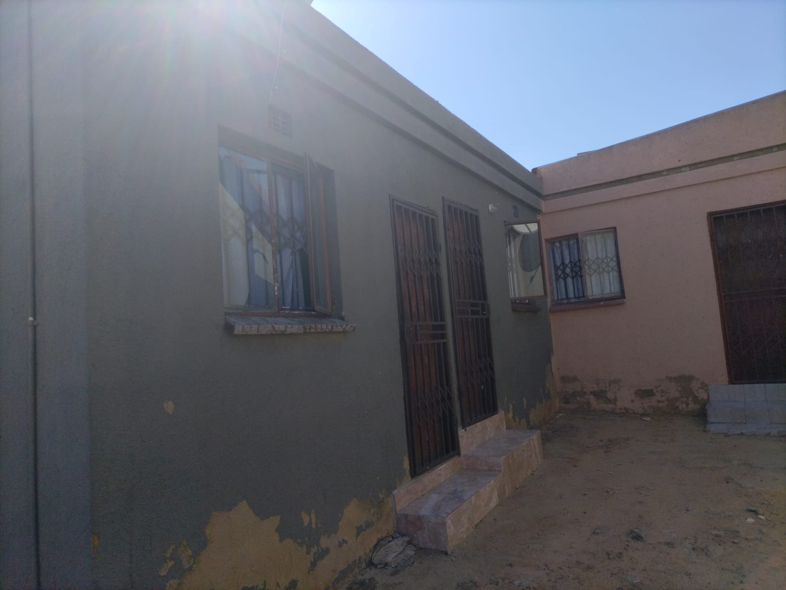 WhatsApp Image 2024-03-11 at 09.51.47 (2) 3 bedroom 1 bathroom with ensuite House and extra 5 outside room with their own meter electricity for investment.!